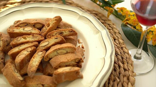 Homemade Italian almond cantuccini biscuits served with glass of vin santo