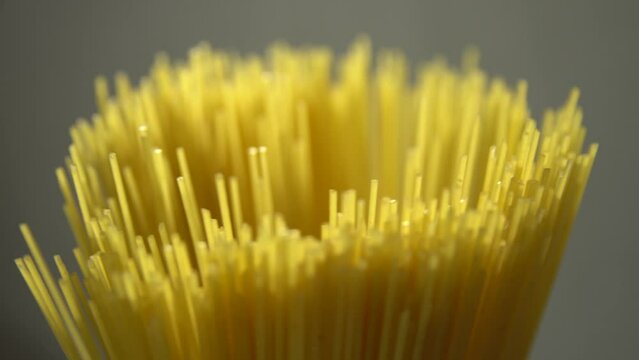 Top view A pack of uncooked spaghetti abstract background of spaghetti pasta rotating close up