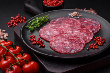 Delicious nutritious breakfast consisting of sliced sausage, asparagus, salt, spices and herbs