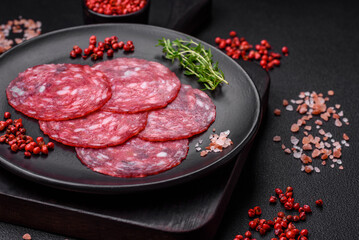 Delicious nutritious breakfast consisting of sliced sausage, asparagus, salt, spices and herbs