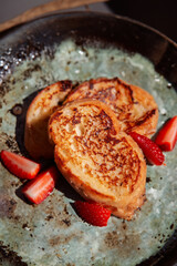 French toast with sliced strawberries