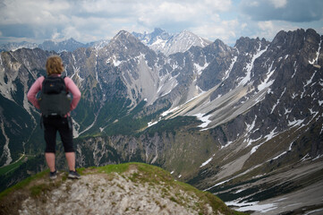 Woman Hiking, Overlooking Austrian Alps from the Top of a Mountain
