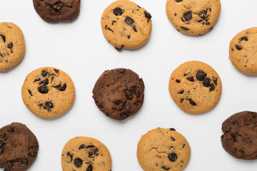 Flat lay with chocolate chip cookies on white background