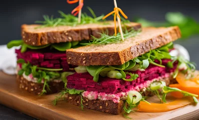 Foto auf Acrylglas Snack Vegan sandwiches with beetroot hummus. sandwich with beet, cheese, avocado and arugula.  