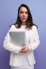 successful brunette business woman holding laptop computer for work