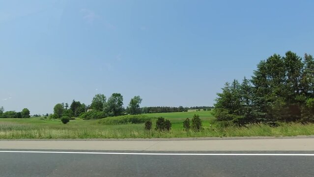 Passenger window side driving view, POV driving on 401 highway during travel. Roads of Canada. Car driving on the road. Countryside adventure view. Long travel.
