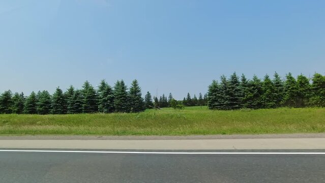 Point of view, right side car view. Passenger window side driving view, POV driving on 401 highway during travel. Roads of Canada. Car driving on the road. Countryside adventure view. Long travel.
