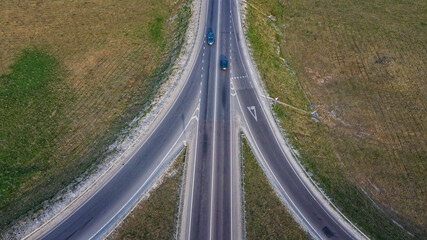 Raod, highway, flyover road junction - spaghetti and roundabout looking down aerial view from above, bird s eye view expressway and intersection landscape, Lviv, Ukraine - obrazy, fototapety, plakaty