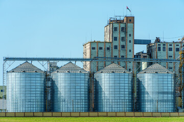 A large modern plant for the storage and processing of grain crops. view of the granary on a sunny...