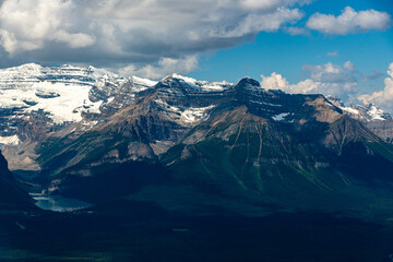 Iconic Lake Louise seen from a distance near the gondola with stunning mountain views surrounding the turquoise nature, national park area.  © Scalia Media