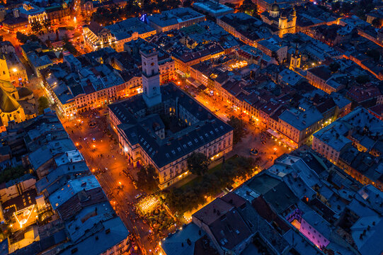 Rooftops of the old town in Lviv in Ukraine during the evening. The magical atmosphere of the European city. Landmark, the city hall and the main square. Drone photo. © Сергій Вовк
