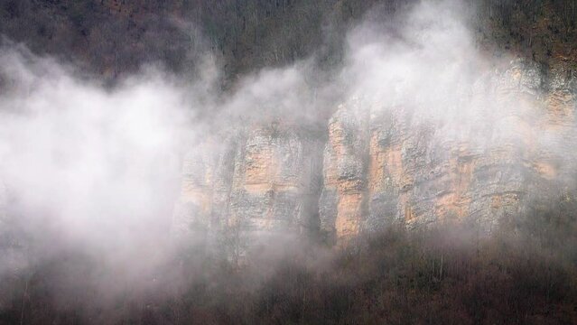 GilГўn, Iran. Spurs of the Elburz mountains and clouds in the valley. Mountain landslide of a limestone mountain in antiquity