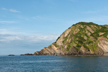 Fototapeta na wymiar Rock formations seen from the harbour in Ilfracombe