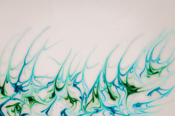 Milky texture with colored smudges and splashes in blue and green tones.Wallpaper abstract White phone.Beautiful pattern