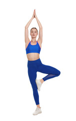 Young woman practicing yoga on white background