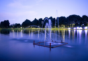 Twilight Serenity. Dynamic Water Jets at Simon Bolivar Park's Lake, Capturing the Tranquil Ambiance...