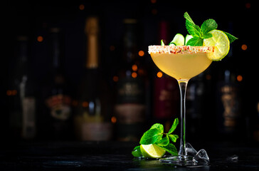 Cucumber margarita alcoholic cocktail drink with tequila, lime juice, syrup, mint and ice in glass...