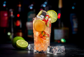 Siam sunrays alcoholic cocktail drink with vodka, coconut liqueur, ginger, chili pepper, soda, lime...