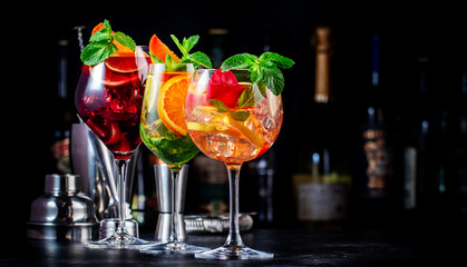 Red, white, rose sangria summer alcoholic cocktail drinks with spanish wine, fruits, citrus and...