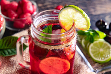 Berry cooling cocktail in a glass jar close-up. Copy space.
