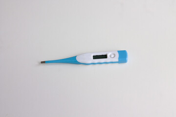 Obraz premium Electronic modern thermometer isolated on white background. Fever diagnostic and healthcare concept
