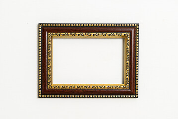 empty picture frame on white wall background