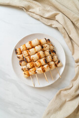 grilled tube shaped fish paste cake skewe or tube squid skewer