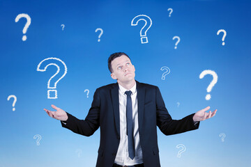 Thoughtful gesture, looking ahead focused, thinking answers to different questions in his head