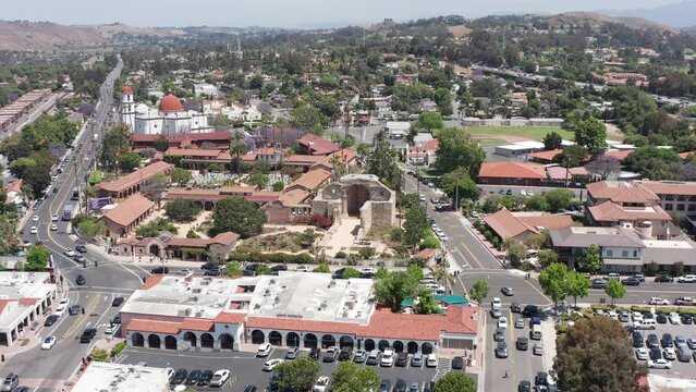 Aerial descending close-up shot of the ruins of the Great Stone Church in the Mission San Juan Capistrano. 4K