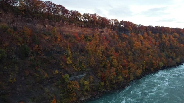 Aerial View Of Lush Autumnal Foliage From Niagara Glen Nature Center. Slow Ascending Pan Right Reveal