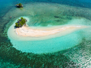 Top view of beautiful sandbar beach with waves and turquoise water atoll. Millari Island. Mindanao, Philippines.