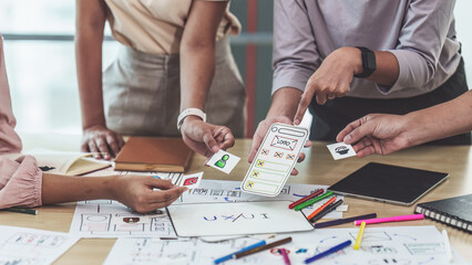 Close up of developer and ui designer brainstorming interface wireframe design.Creative digital...