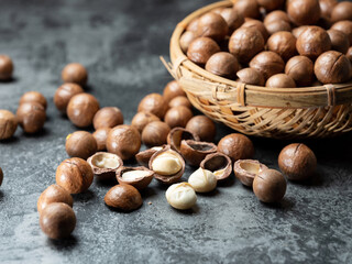 Roasted macadamia nuts on a dark background