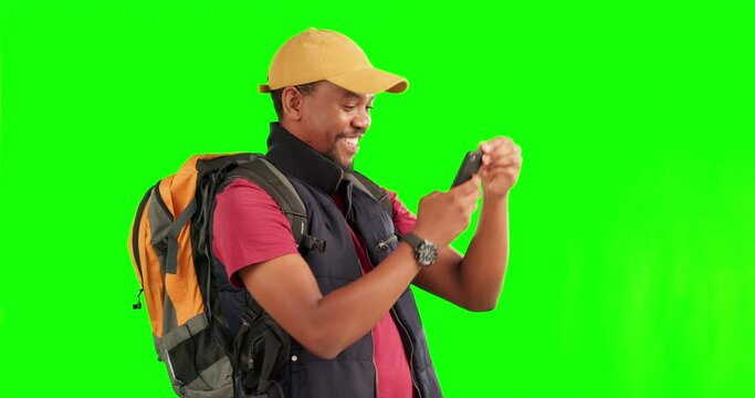 Green screen, travel and black man with phone photography on adventure, journey or happy memory of hiking with backpack. Smartphone, taking pictures and excited tourist trekking on tour or hike