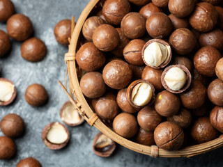 Roasted macadamia nuts on a dark background