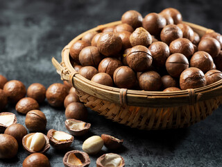 Roasted macadamia nuts on a dark background