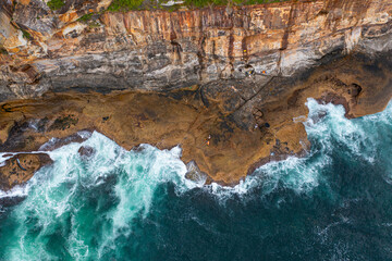 Aerial drone view of people fishing using a fishing rods