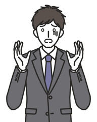 怯えるスーツを着た男性