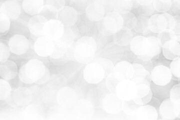 Blurred abstract background. Abstract white and silver blurred background with glittering lights...