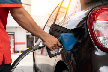 Car refueling on petrol station. Fuel pump at station. Refueling the car at a gas station fuel...