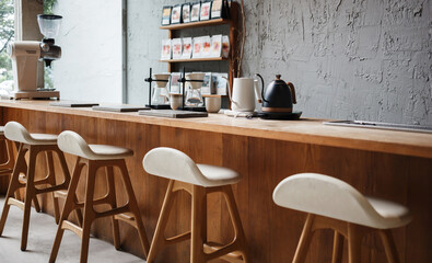 Seat and wooden counter with coffee equipment on counter bar and wooden shelf on rough cement wall....