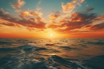 Fototapeta premium Scenic sunset over the ocean with yellow and orange hues. Generative AI