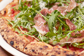 pizza with salami and vegetables