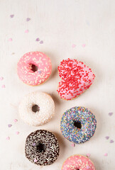 Glazed colored donuts.