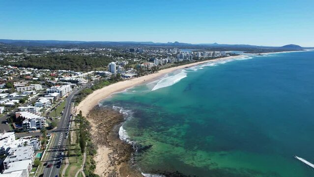 Suburban Beachfront of Mooloolaba Beach, Maroochydore in the Sunshine Coast of Queensland, Australia. aerial pan left