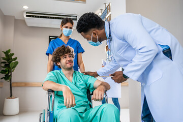 Attractive doctor walk through the hallway to visit patient in hospital. 