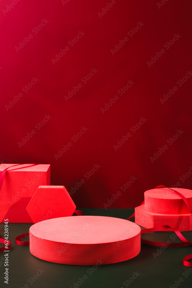Aufkleber red pedestal product display and ribbon on red and dark green background with modern geometric block