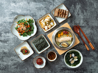 Fototapeta na wymiar Korean traditional food, various side dishes and abalone pot rice