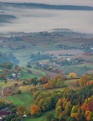 Fototapeta na wymiar Fall landscape in Slovakia. Rural countryside in Polana region. Fields and meadows with autumn trees in Hrinova at sunrise.