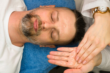 Fototapeta na wymiar Facial massage for man